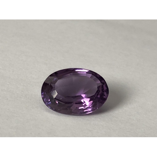 25 - A natural amethyst stone, unmounted, oval, 11.7 ct (2)