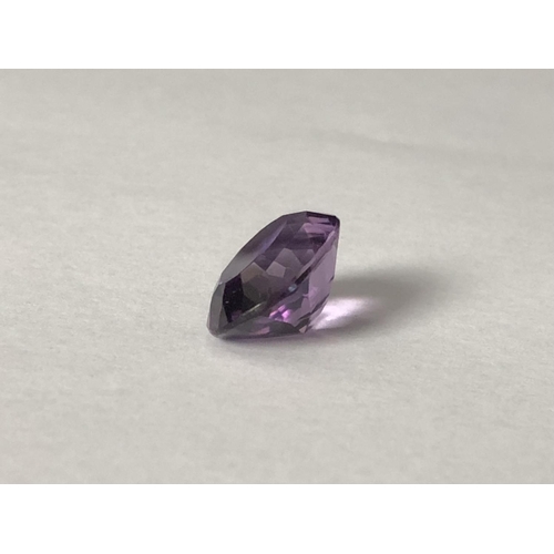 25 - A natural amethyst stone, unmounted, oval, 11.7 ct (2)