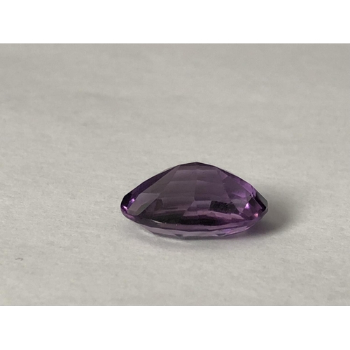 25 - A natural amethyst stone, unmounted, oval, 11.7 ct (2)