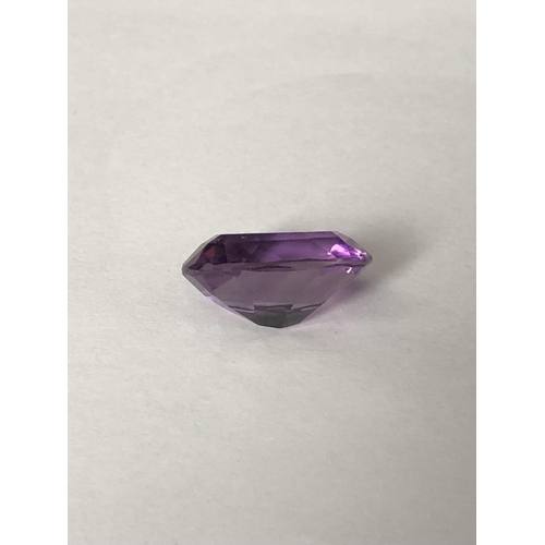 25 - A natural amethyst stone, unmounted, oval, 11.7 ct (2)