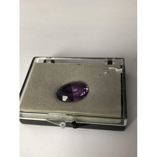 25 - A natural amethyst stone, unmounted, oval, 11.7 ct (2)