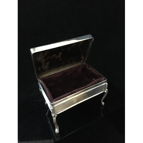 39 - A stained horn and silver pique work box in the form of a writing table, the upper surface decorated... 