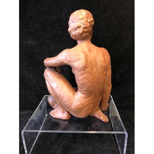 139 - An Art Deco style terracotta figure of a seated nude female, probably Austrian, impressed 12 to base... 