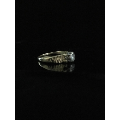 42 - An 18ct yellow gold diamond set single stone ring, the round brilliant cut stone approx. 3.2mm, 0.13... 