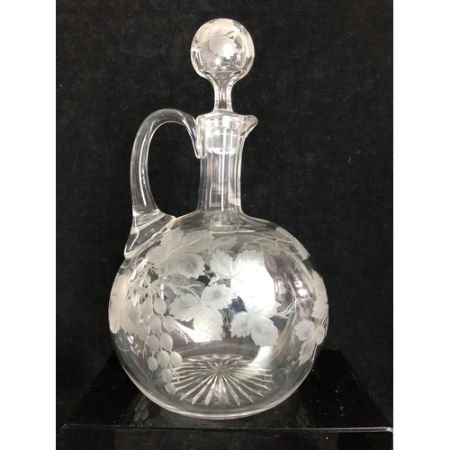 99 - Stourbridge Glass - A claret jug of flattened globular body with fluted neck and blown globular stop... 