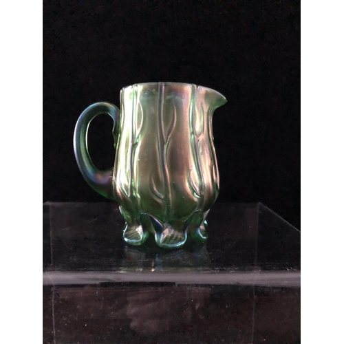 48 - A Loetz Neptun iridescent blue green glass cream jug, the body moulded with strands of seaweed over ... 