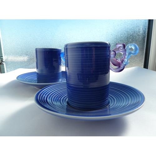 56 - Loretta Hui-shan Yang or Yang Huishan - two ribbed and blue glazed porcelain cups and saucers, the c... 