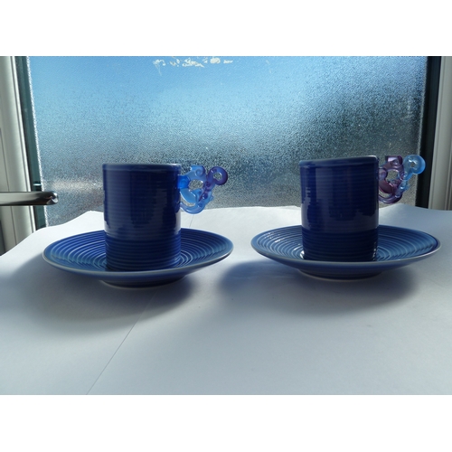 56 - Loretta Hui-shan Yang or Yang Huishan - two ribbed and blue glazed porcelain cups and saucers, the c... 