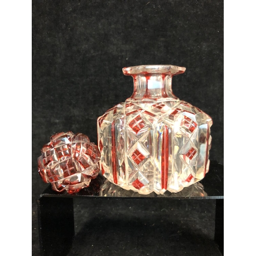 61 - Bohemian Glass - A ruby flashed colourless glass perfume bottle, of cylindrical form and octagonal s... 