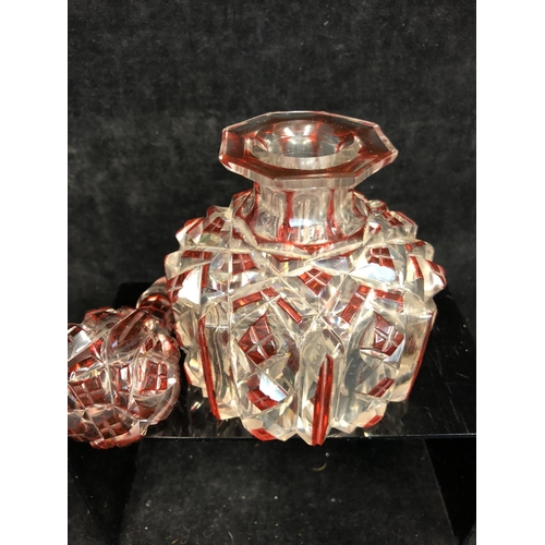 61 - Bohemian Glass - A ruby flashed colourless glass perfume bottle, of cylindrical form and octagonal s... 