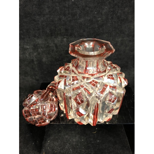 61 - Bohemian Glass - A ruby flashed colourless glass perfume bottle, of cylindrical form and octagonal s... 