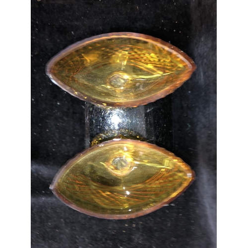 52 - Bohemian Glass - A pair of amber glass boat form pedestal salts, cut with hobnail banding and dentil... 