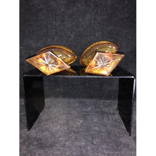 52 - Bohemian Glass - A pair of amber glass boat form pedestal salts, cut with hobnail banding and dentil... 