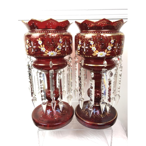 51 - Bohemian Glass - A pair of ruby glass table lustres, the bowls with crenelated rim, gilded and ename... 