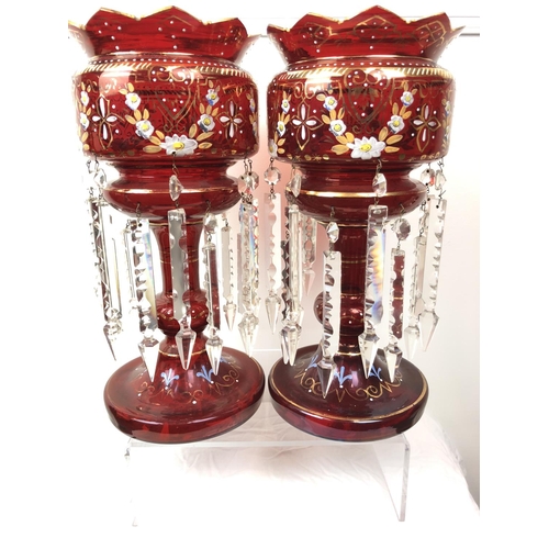 51 - Bohemian Glass - A pair of ruby glass table lustres, the bowls with crenelated rim, gilded and ename... 