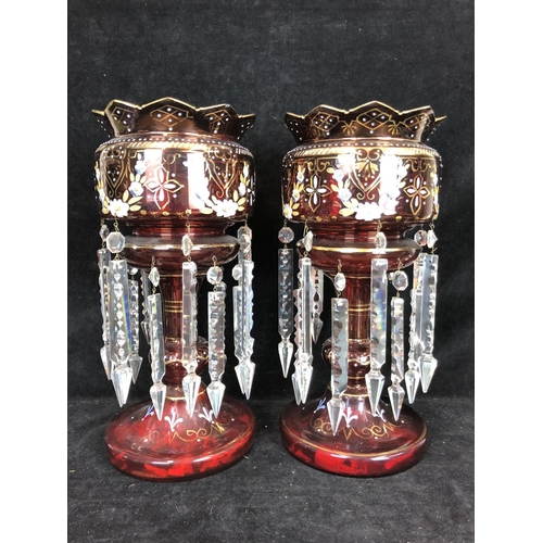 51 - Bohemian Glass - A pair of ruby glass table lustres, the bowls with crenelated rim, gilded and ename... 