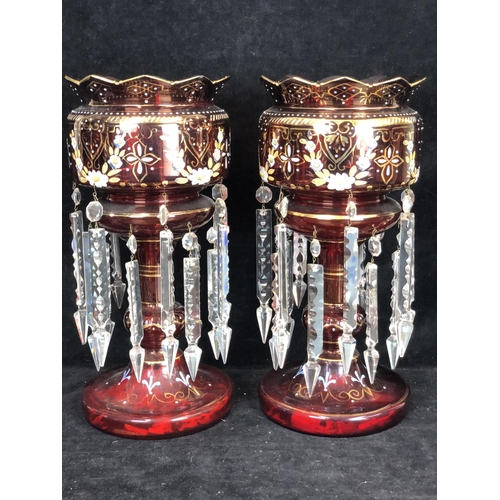 51 - Bohemian Glass - A pair of ruby glass table lustres, the bowls with crenelated rim, gilded and ename... 