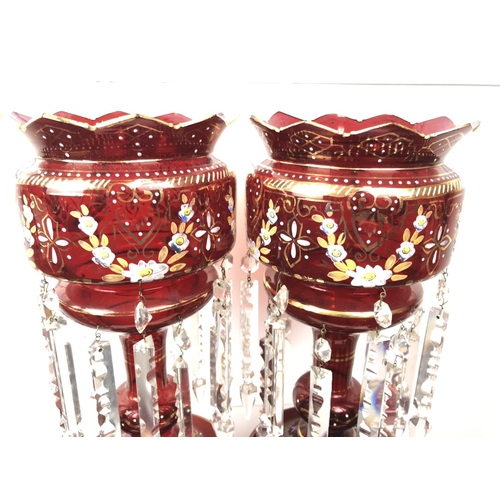 51 - Bohemian Glass - A pair of ruby glass table lustres, the bowls with crenelated rim, gilded and ename... 