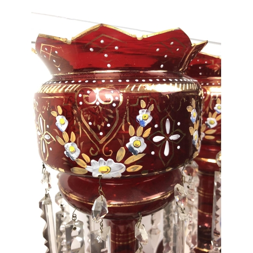 51 - Bohemian Glass - A pair of ruby glass table lustres, the bowls with crenelated rim, gilded and ename... 