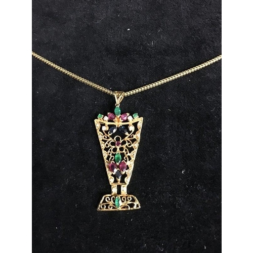 46 - A gem set yellow gold wire pendant, of vase form of floral decoration, set with rubies, emeralds, di... 