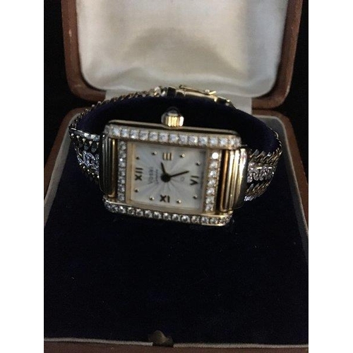 47 - A Ladies Voski Geneve Q diamond set wristwatch, rectangular set with 50 claw set round brilliant cut... 