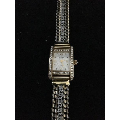 47 - A Ladies Voski Geneve Q diamond set wristwatch, rectangular set with 50 claw set round brilliant cut... 