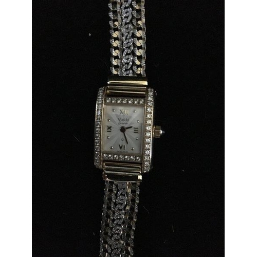 47 - A Ladies Voski Geneve Q diamond set wristwatch, rectangular set with 50 claw set round brilliant cut... 