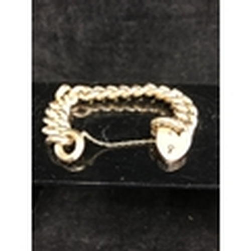 3 - An 9ct gold heavy chain link bracelet, with heart form padlock clasp, the top surface of the links e... 