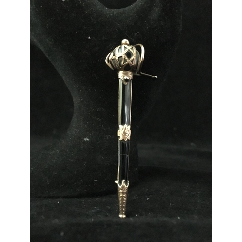 240 - A rose gold and onyx Scottish broadsword plaid brooch, with ornate pierced and chased basket hilt an... 