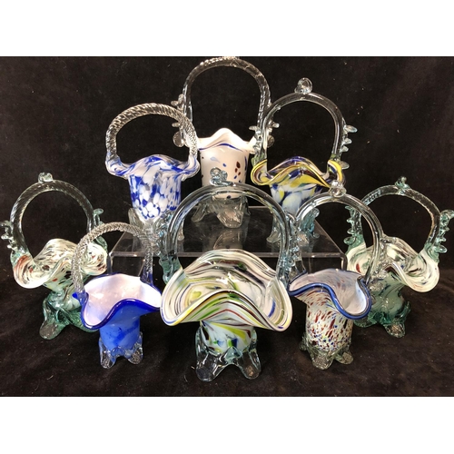 111 - A group of eight Czechoslovakian spatter glass Brides Baskets, colourless pincer work handles and fe... 