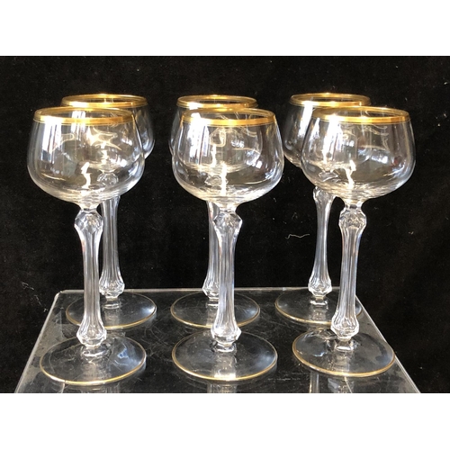 113 - A set of six hollow stem wine glasses, probably St Louis, the bowls lined in gilding, unmarked, 18cm... 