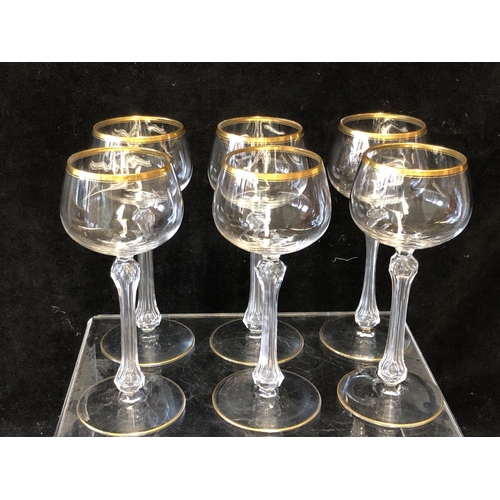 113 - A set of six hollow stem wine glasses, probably St Louis, the bowls lined in gilding, unmarked, 18cm... 