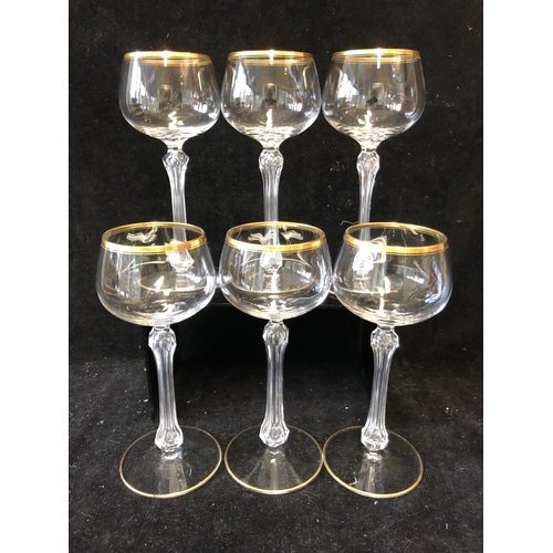 113 - A set of six hollow stem wine glasses, probably St Louis, the bowls lined in gilding, unmarked, 18cm... 