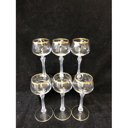 113 - A set of six hollow stem wine glasses, probably St Louis, the bowls lined in gilding, unmarked, 18cm... 