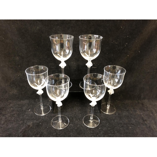 115 - Six Lalique Roxane pattern white wine glasses, the stem knop formed as two female figures entwined a... 