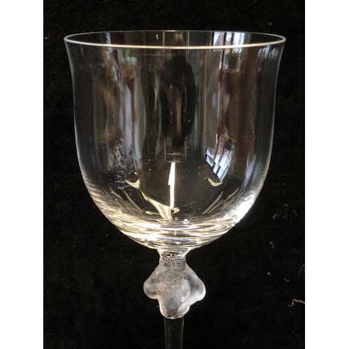 115 - Six Lalique Roxane pattern white wine glasses, the stem knop formed as two female figures entwined a... 