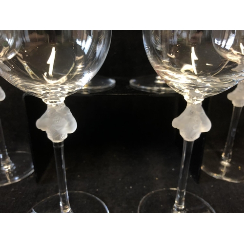 116 - Six Lalique Roxane pattern red wine glasses, the stem knop formed as two female figures entwined aro... 