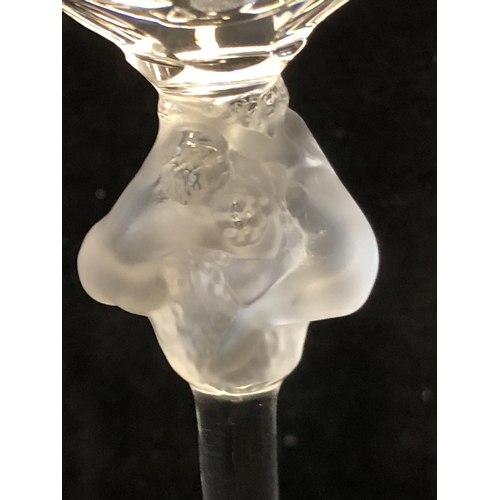 117 - Two Lalique Roxane pattern Champagne glasses, the stem knop formed as two female figures entwined ar... 