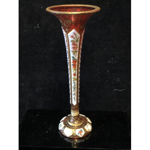 118 - A Bohemian overlay glass bud vase, the white overlay cut through to ruby with  alternate strawberry ... 