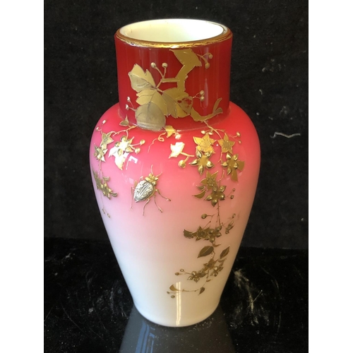 122 - A Bohemian peach blow overlay glass baluster vase, graduated deep pink over white, gilded with flowe... 