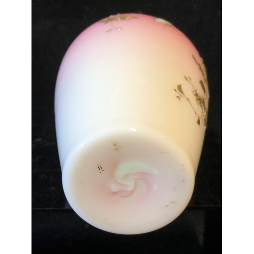 122 - A Bohemian peach blow overlay glass baluster vase, graduated deep pink over white, gilded with flowe... 