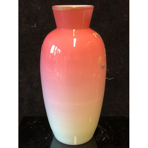 122 - A Bohemian peach blow overlay glass baluster vase, graduated deep pink over white, gilded with flowe... 