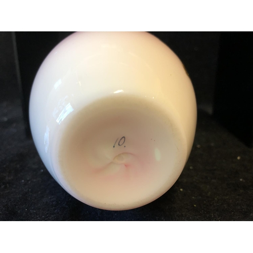 124 - A Bohemian peach blow overlay glass ovoid vase, graduated deep pink over white, gilded with a flower... 