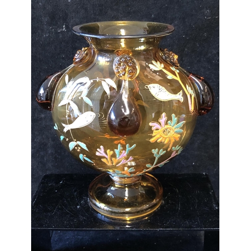 125 - A Continental glass moon vase, in the style of Moser, the deep amber coloured glass body enamelled w... 