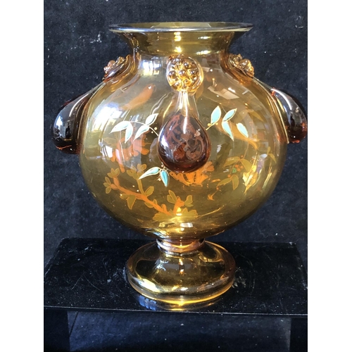 125 - A Continental glass moon vase, in the style of Moser, the deep amber coloured glass body enamelled w... 