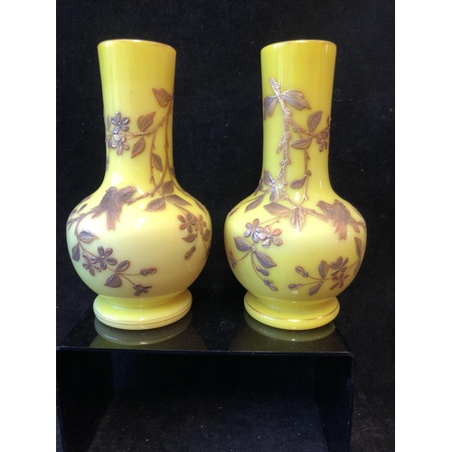 127 - A pair of Harrach overlay glass vases, of stout bottle form, yellow over shell pink, gilded with flo... 