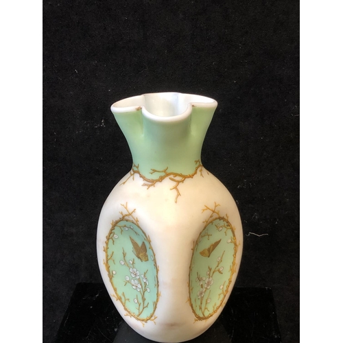 129 - A Harrach overlay glass vase, cream and green over white, of dimpled ovoid body with quatrefoil flut... 