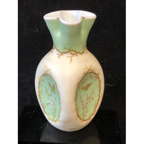 129 - A Harrach overlay glass vase, cream and green over white, of dimpled ovoid body with quatrefoil flut... 