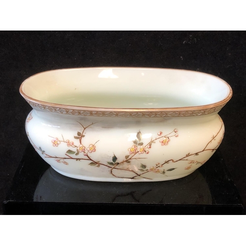 130 - A Harrach glass oval bowl, gilded and enamelled with flowering prunus branches beneath a rice trelli... 