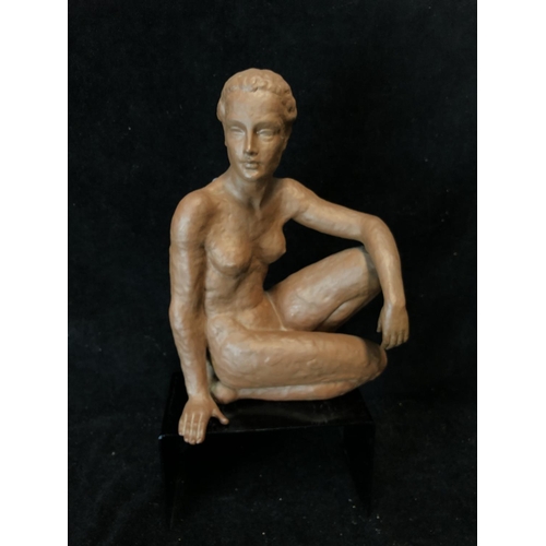 139 - An Art Deco style terracotta figure of a seated nude female, probably Austrian, impressed 12 to base... 